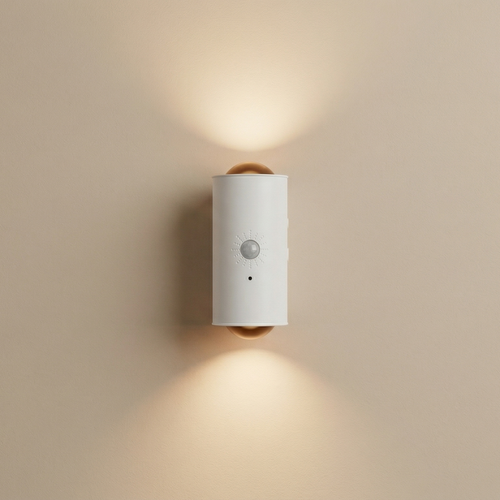 Wall-mounted light fixture with sensor on a beige wall